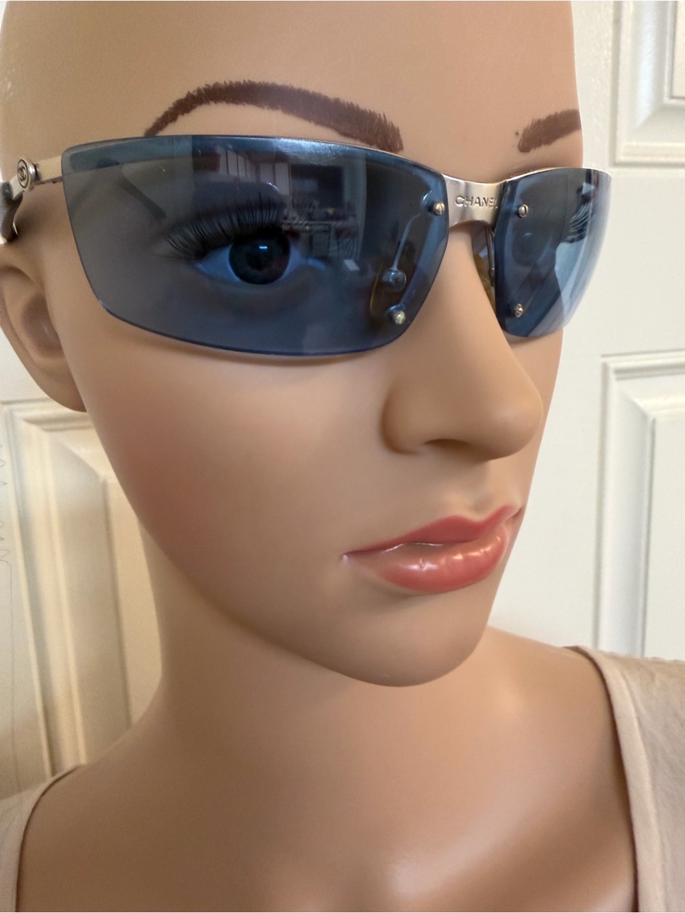 Women’s Vintage Chanel 4008 semi-rimless sport sunglasses.